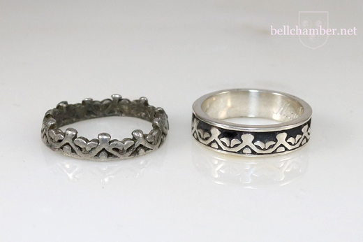 The original pewter ring next to the Sterling Silver copy.